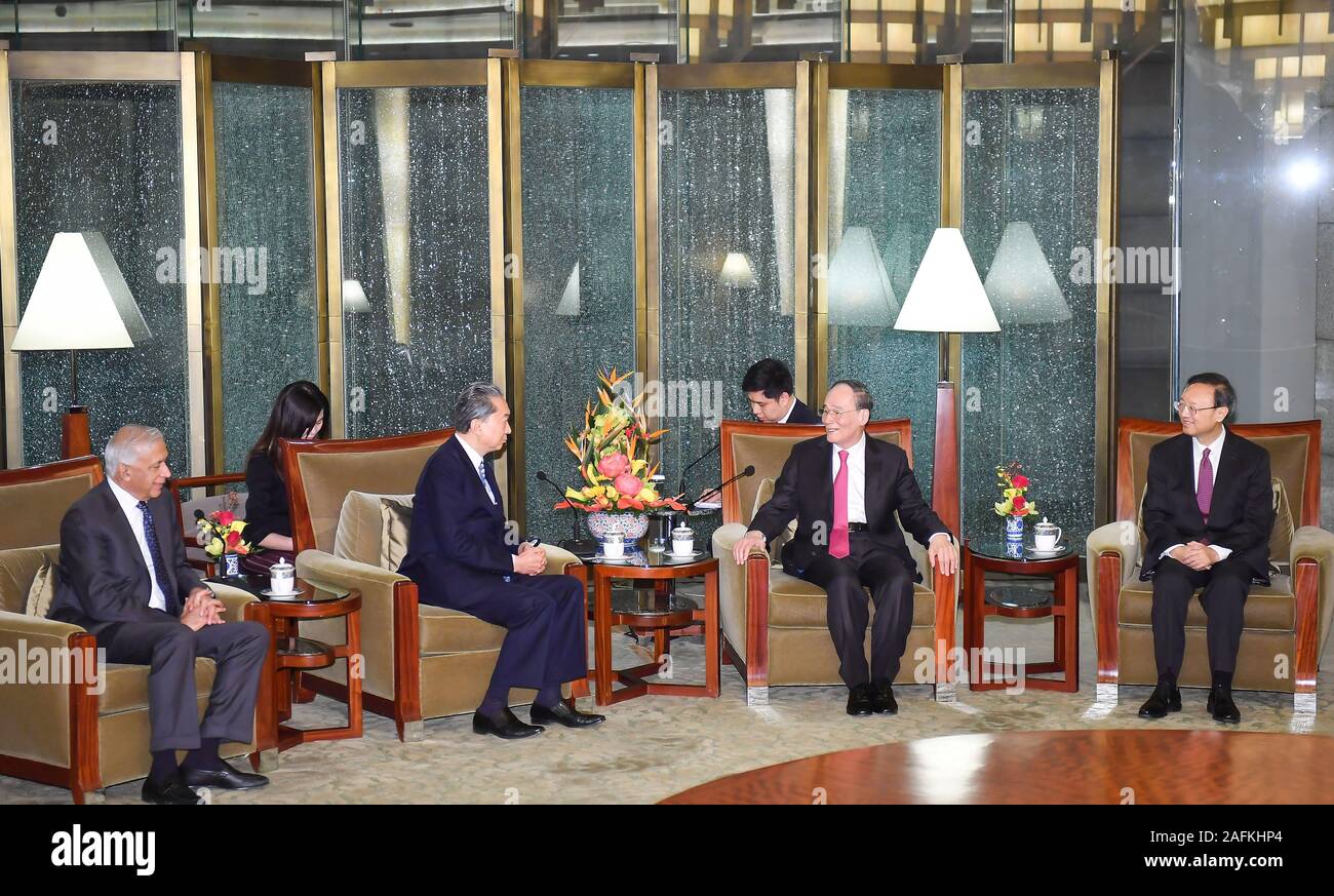 (191216) -- BEIJING, Dec. 16, 2019 (Xinhua) -- Chinese Vice President Wang Qishan (2nd R) meets with former Japanese Prime Minister Yukio Hatoyama (2nd L front) and other former foreign politicians and foreign diplomats based in China prior to a reception commemorating the 70th anniversary of the founding of the Chinese People's Institute of Foreign Affairs (CPIFA), in Beijing, capital of China, Dec. 16, 2019. (Xinhua/Li Xiang) Stock Photo