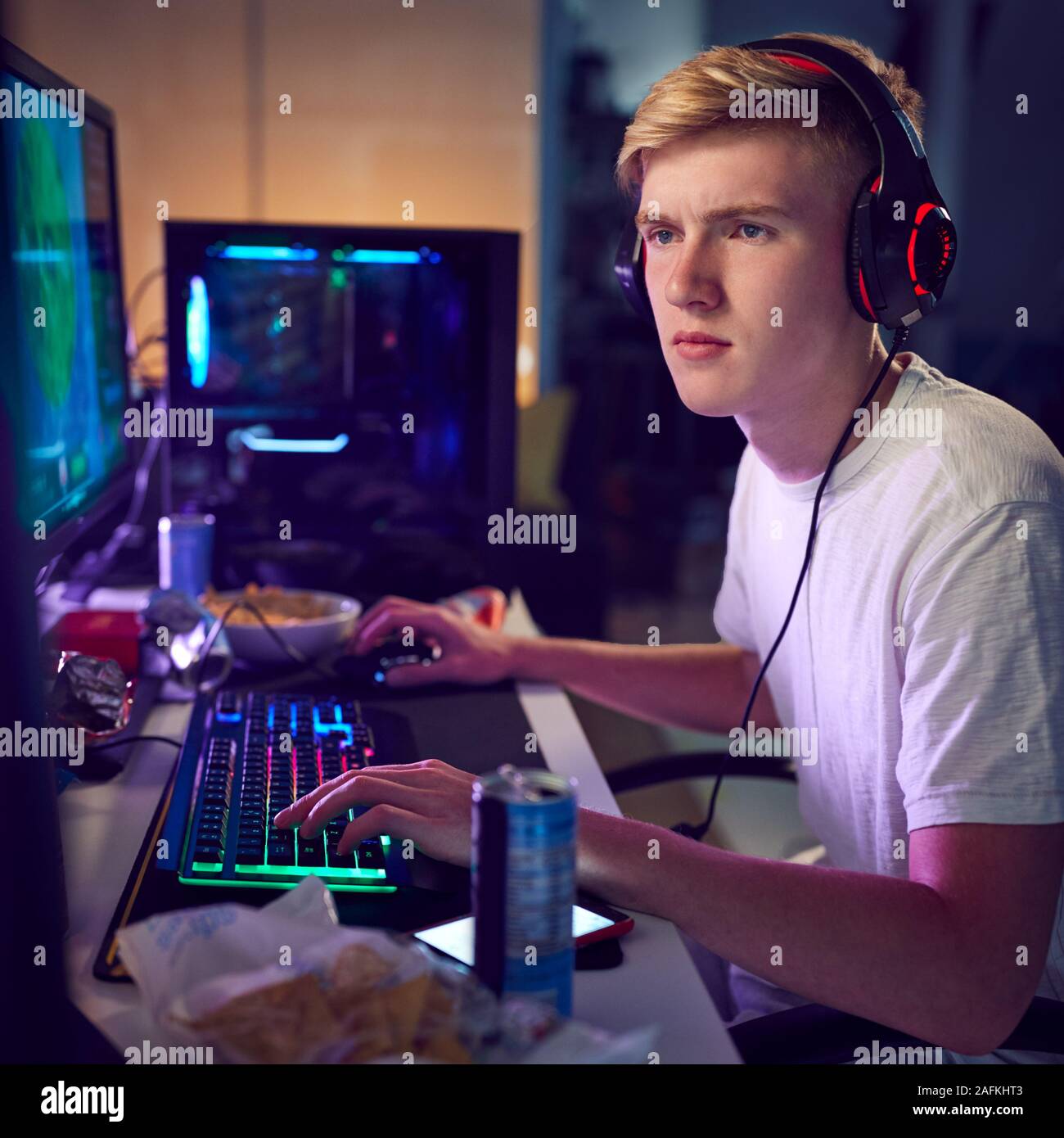 Young Man Wearing Headset And Play Computer Video Games Online Home  Isolated For Coronavirus Stock Photo - Download Image Now - iStock