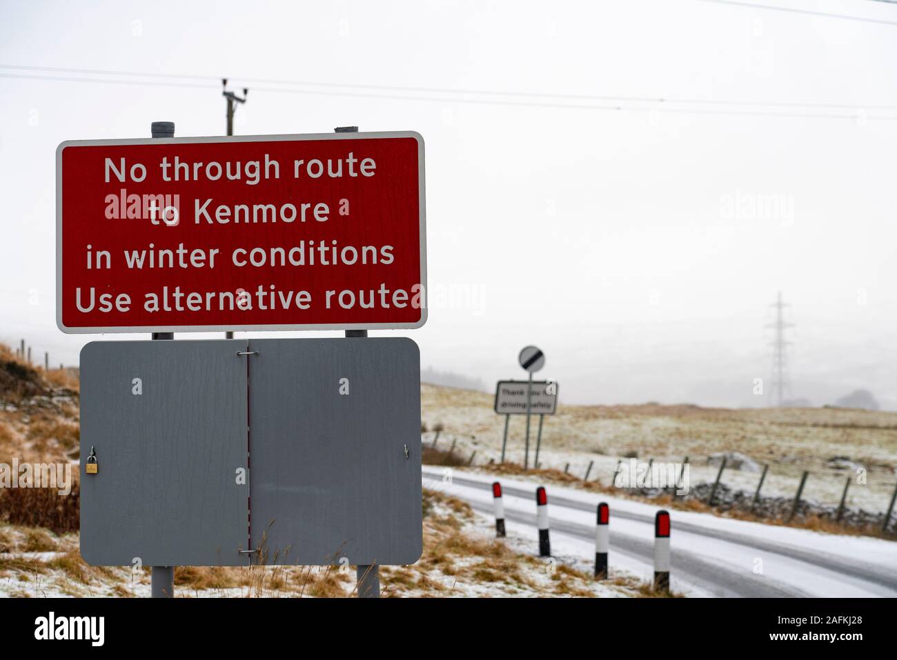 Amulree, Perthshire, Scotland, UK. 16th Dec 2019. Warning sign on single-track U173 Kenmore to Amulree road seen during a wintry snow fall today. Police and Perth and Kinross Council plan to close a five-mile long stretch of the scenic road through Glen Quaich for 17 weeks from 23 Dec 2019 because it is too dangerous in snow and ice. The road through Glen Quaich is regarded as one of the most picturesque, and dangerous, in Perthshire. Stock Photo