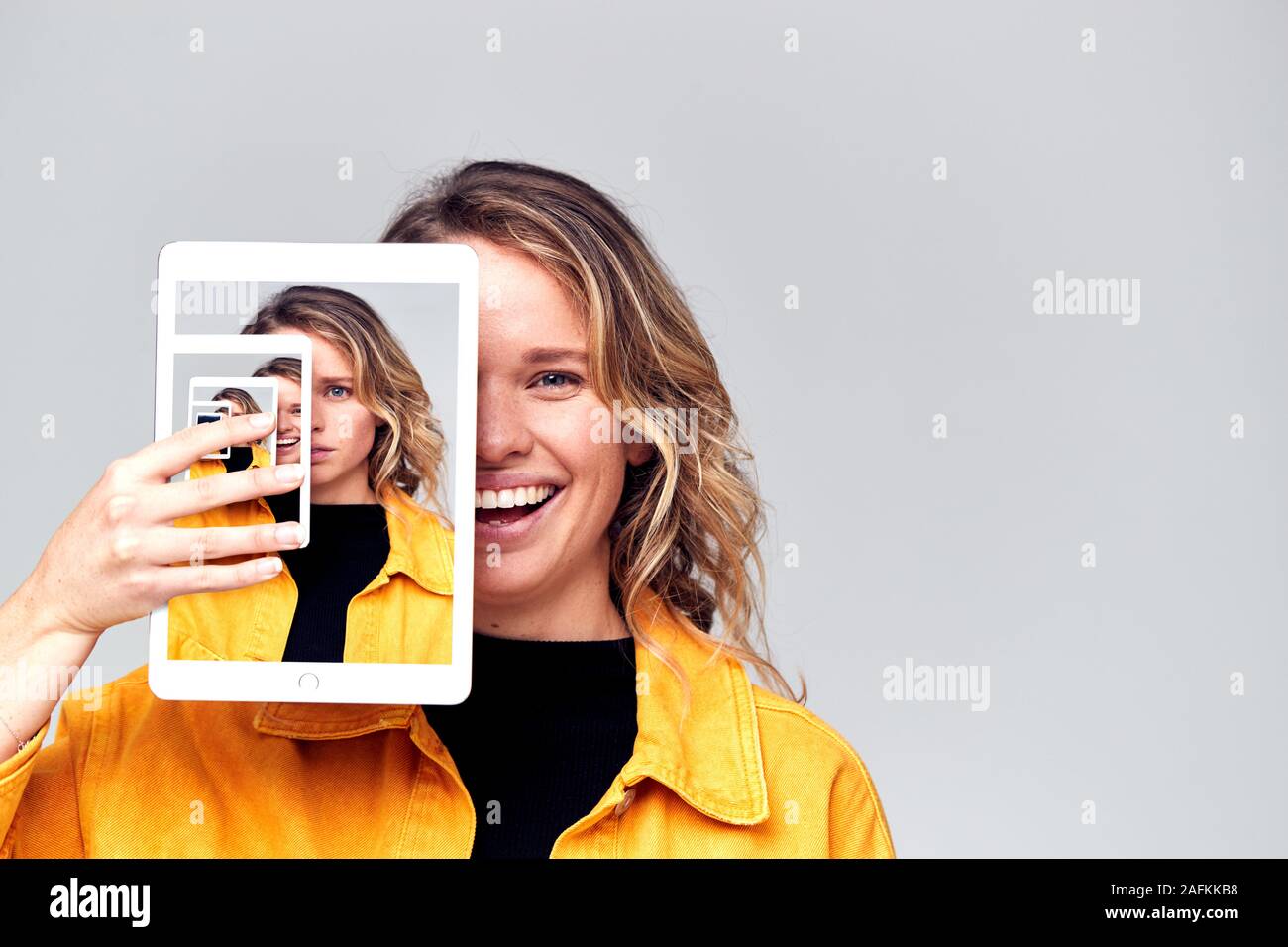 Composite Concept Image Showing Contrasting Emotions Of Woman Using Social Media With Digital Tablet Stock Photo