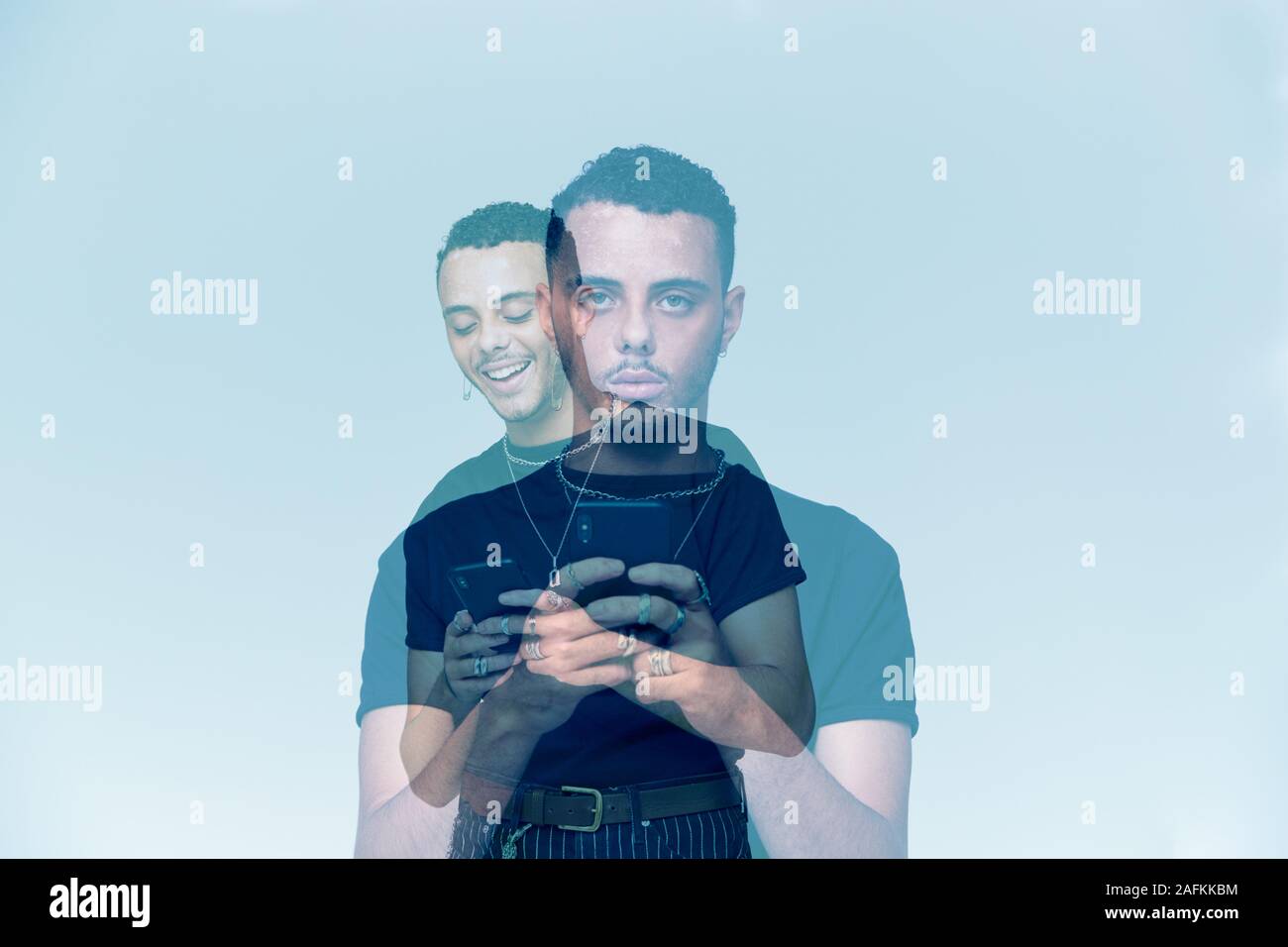 Composite Concept Image Showing Young Man With Mobile Phone Suffering With Social Anxiety Stock Photo