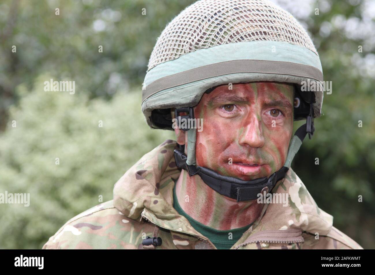 British Army Soldier in army greens camo outfit, jacket, and helmet Stock  Photo - Alamy