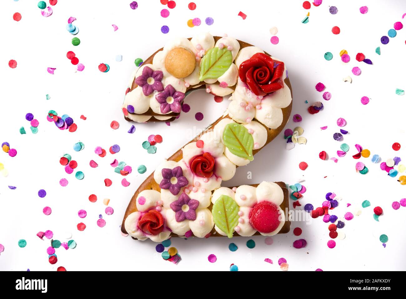 Number Two Cake Decorated With Flowers Macarons And Confetti