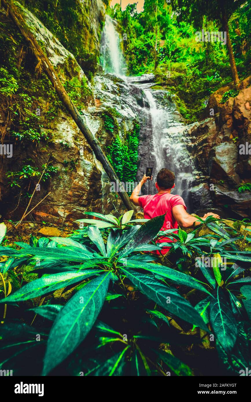 Majestic waterfall in the rainforest jungle of Costa Rica. Tropical hike. Stock Photo