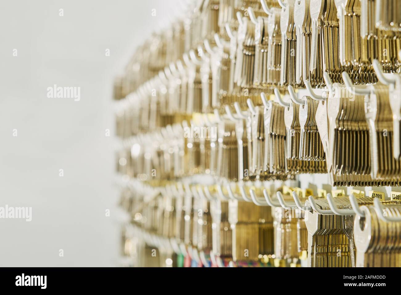 duplicates of keys of house and doors in the wall of a locksmith's shop to be able to make the copies Stock Photo