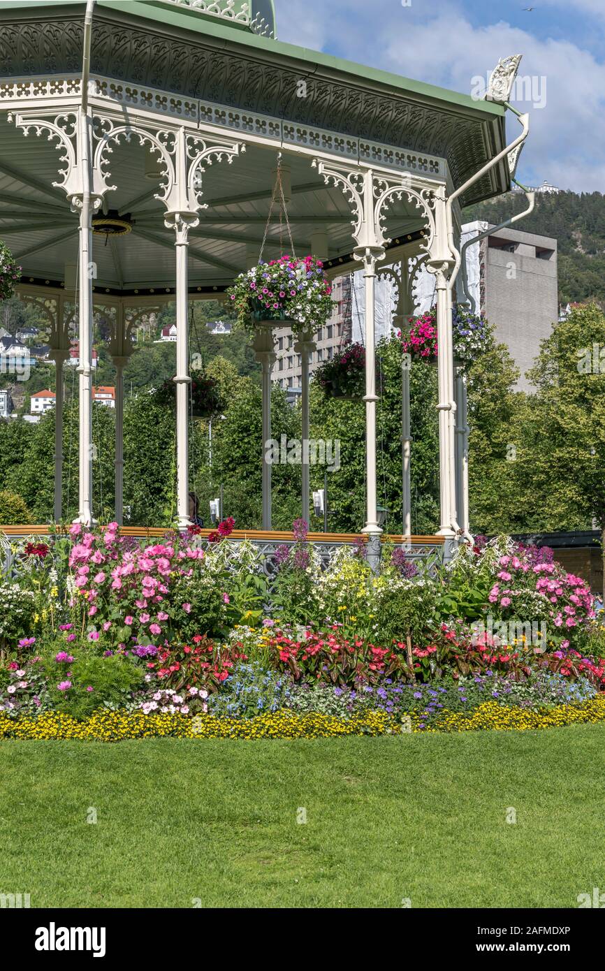 blossoming flowers at gazebo in urban park, shot under bright summer  light at Bergen, Norway Stock Photo