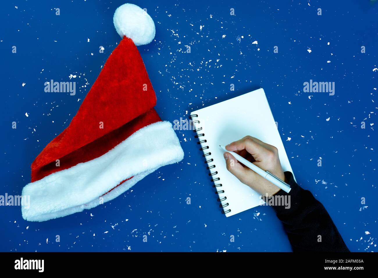 Man writes plans and goals. Stock Photo