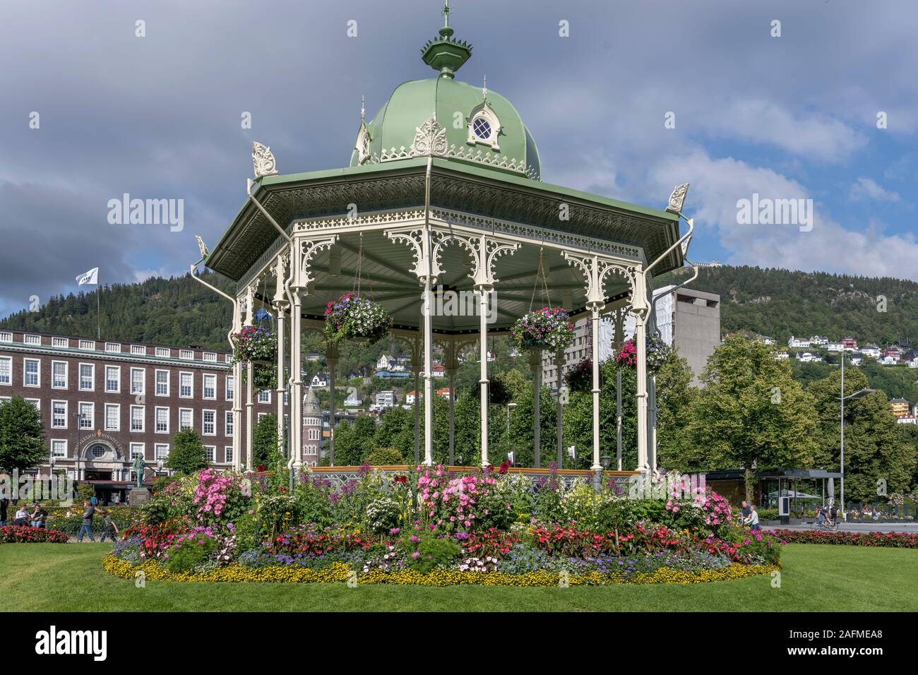 BERGEN, NORWAY - July 19 2019: touristic town cityscape with blossoming gazebo in urban park, shot under bright summer  light on july 19, 2019 at Berg Stock Photo