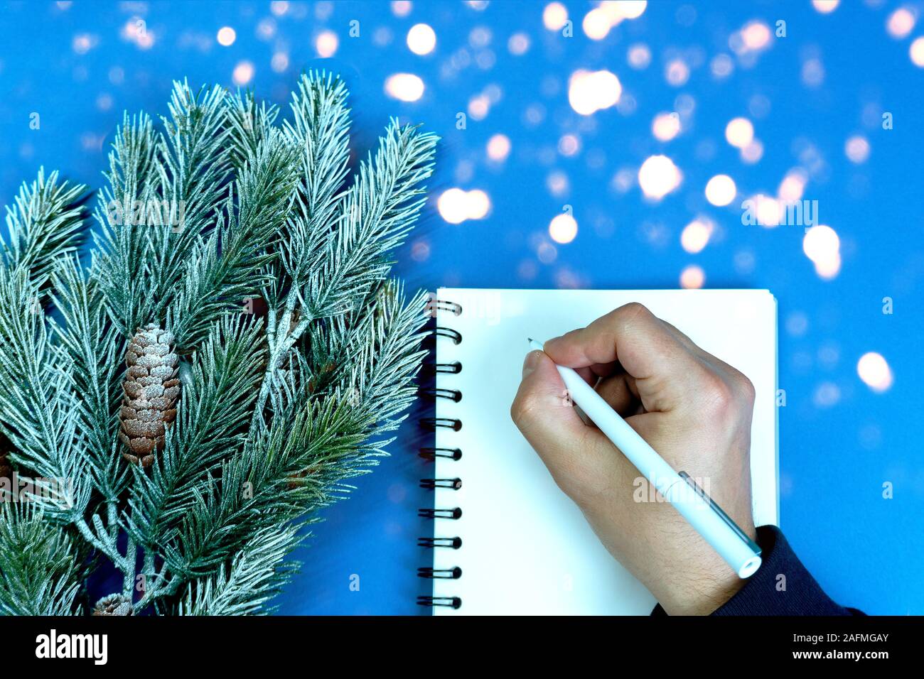 Man writes plans and goals. Stock Photo