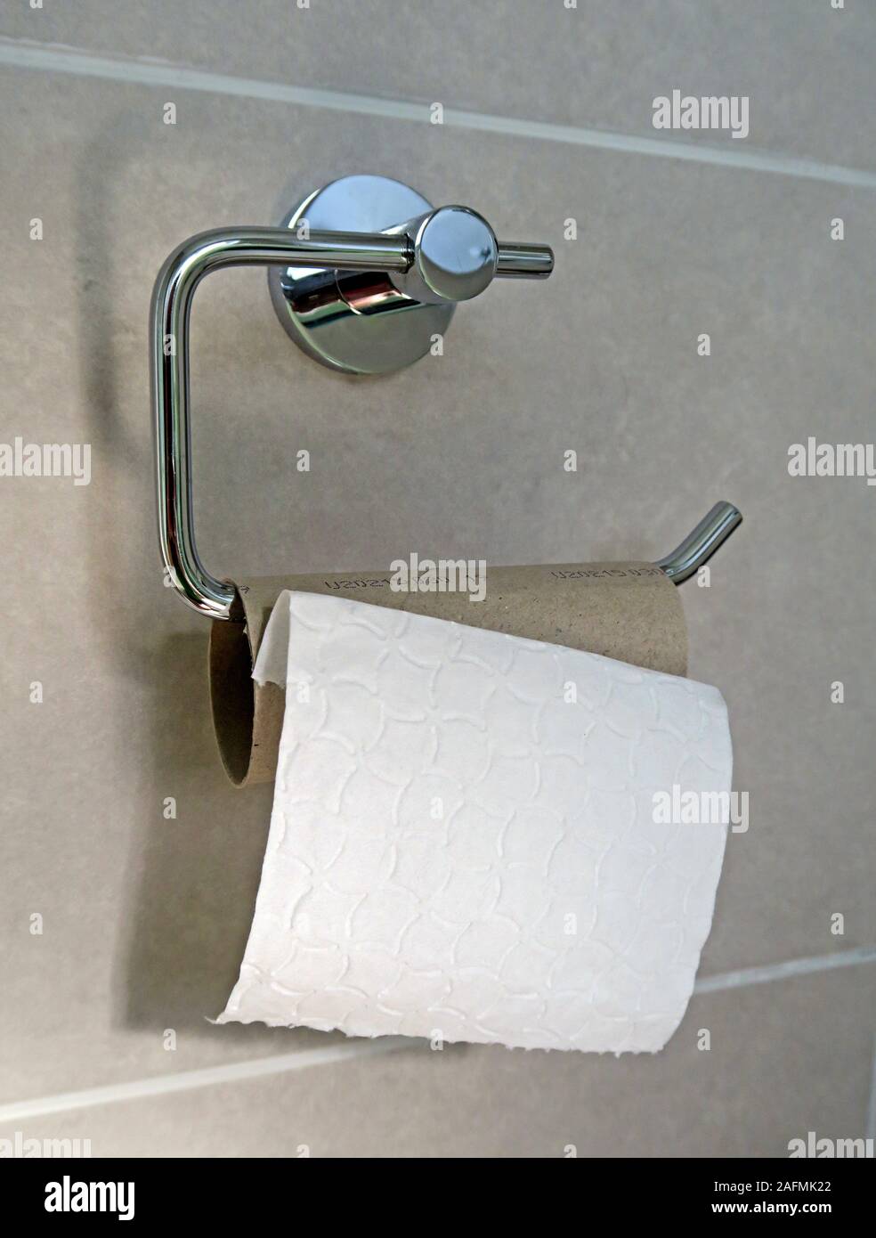 The ultimate toilet crime, finishing the toilet roll and not replacing it Stock Photo