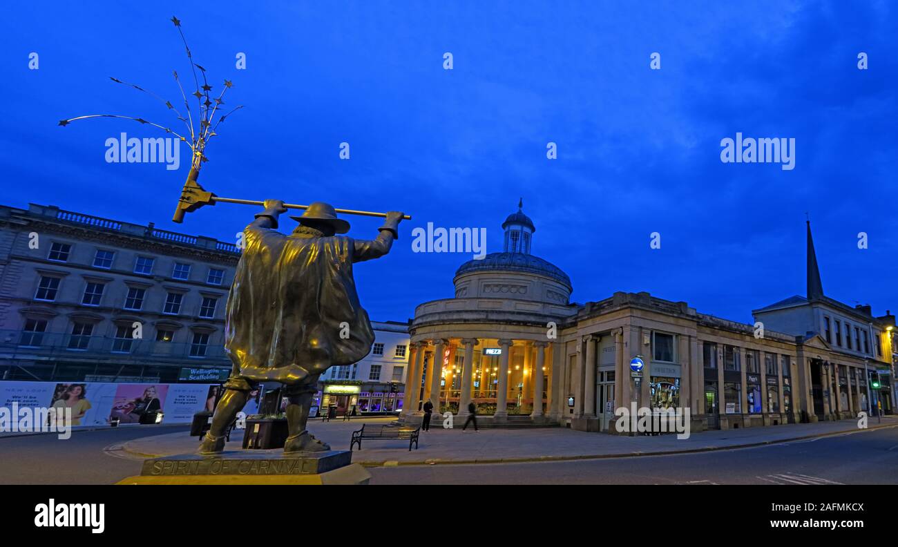 The Spirit of Carnival statue and old market, Bridgwater Town Centre, Sedgemoor District Council, Somerset ,South West England, UK at dusk Stock Photo