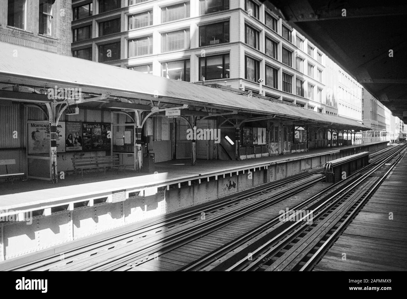 Chicago, Illinois, USA - 1996:  Archival black and white view of elevated train tracks and downtown architecture along Wabash Ave. Stock Photo