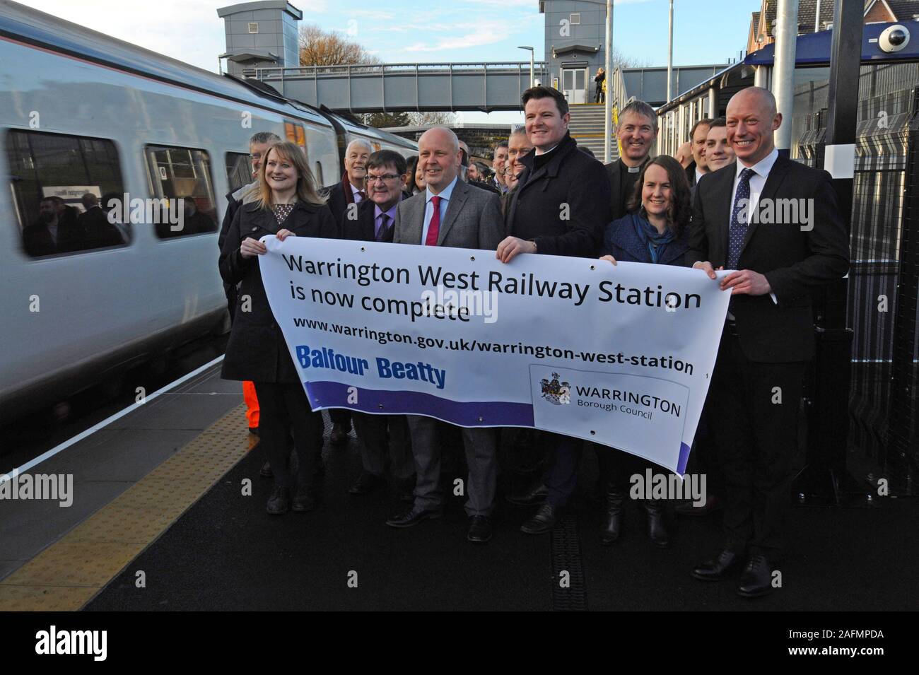 Warrington, Cheshire, UK. 16th Dec, 2019. Council leaders, railway staff and local dignitaries attend the official opening of Warrington West railway station. The £20.5 million station project has been funded by Warrington Borough Council, the Department for Transport, developer contributions and Cheshire and Warrington Local Enterprise Partnership. The station is managed by Northern Trains and will provide vital links for the Chapelford community to Liverpool and Manchester, with 4 trains per hour, a 250 car capacity park and ride and local bus services. Credit: G.P.Essex/Alamy Live News Stock Photo