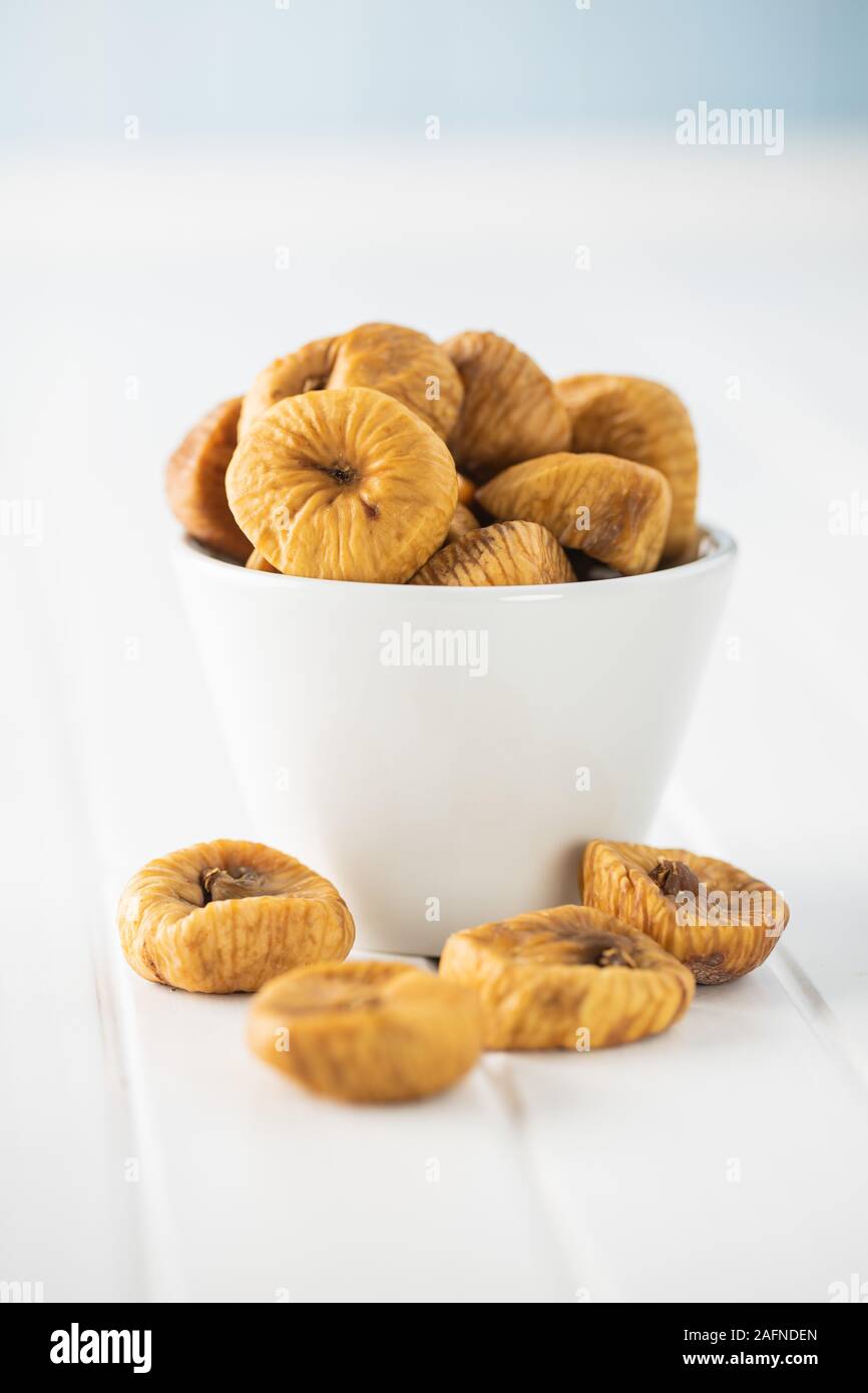Sweet dried figs on white table. Stock Photo