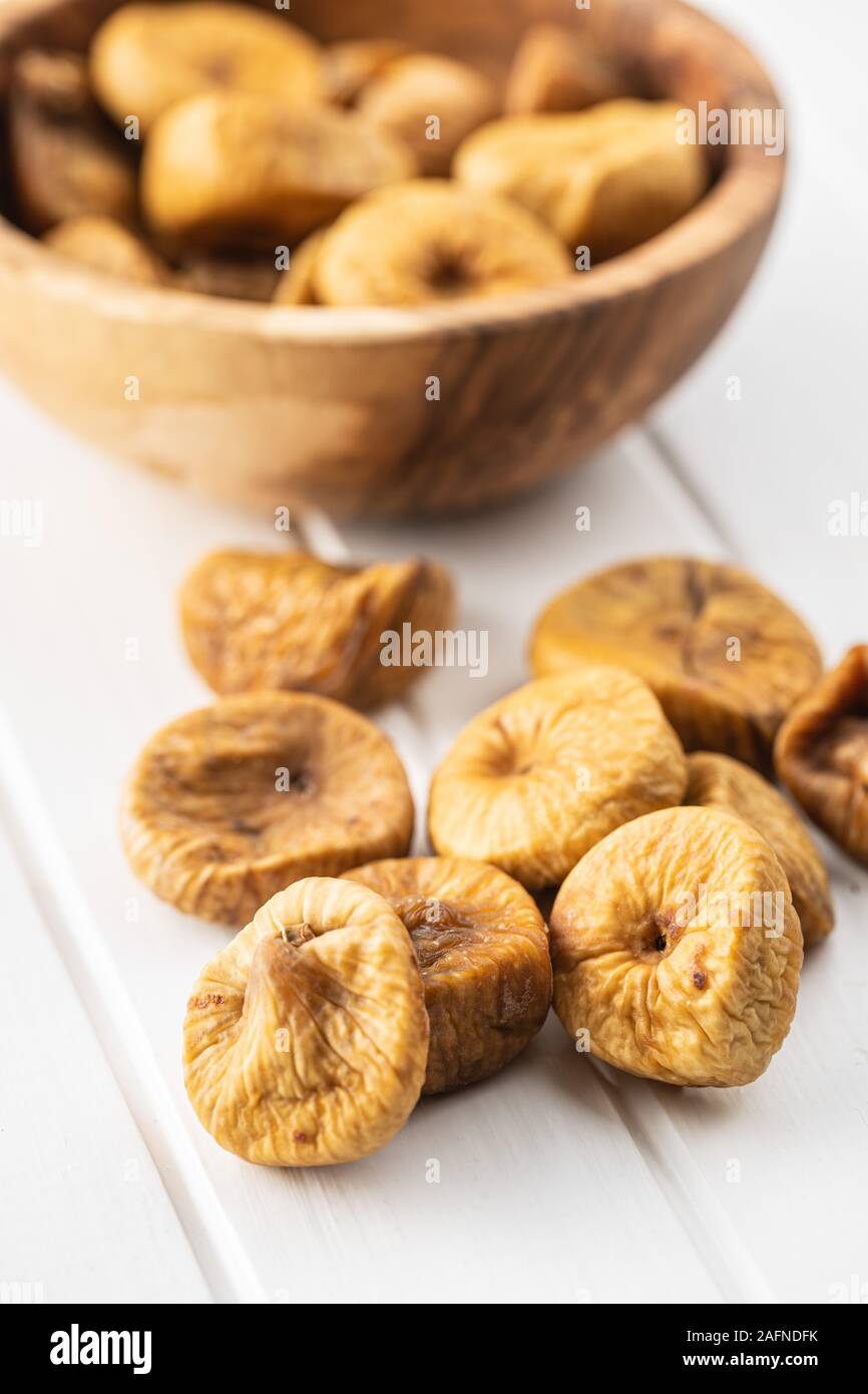 Sweet dried figs on white table. Stock Photo