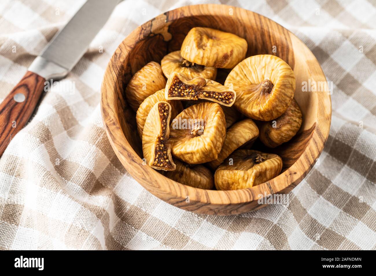 Sweet dried figs in bowl Stock Photo - Alamy