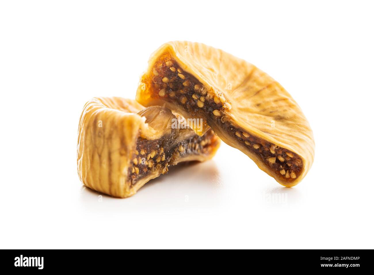 Sweet dried figs isolated on white background. Stock Photo