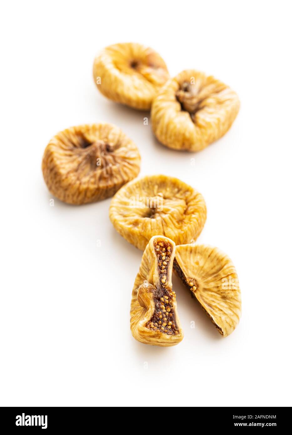 Sweet dried figs isolated on white background. Stock Photo