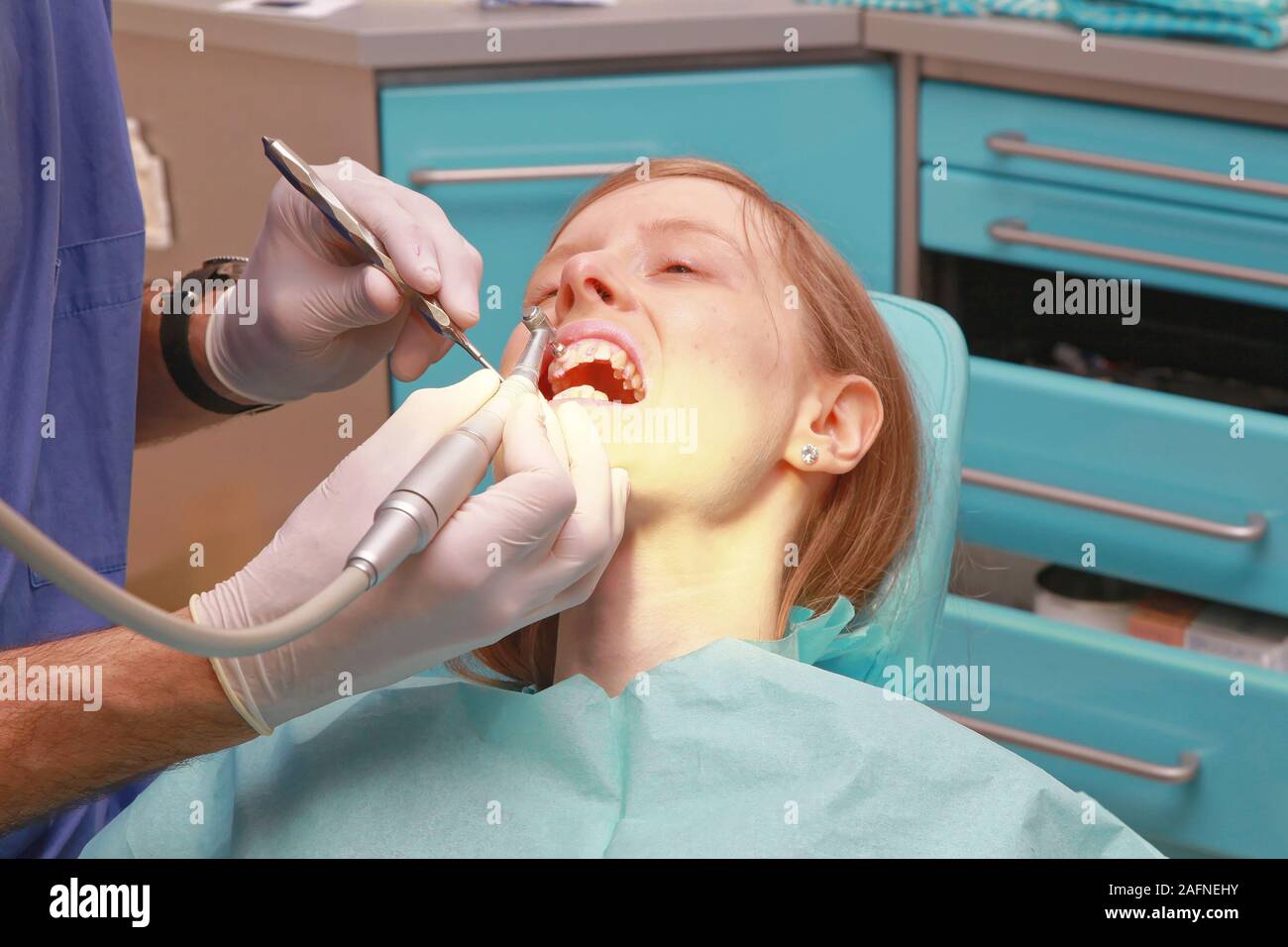 Dentist Polishing and Cleaning Teeth of Young Lady Stock Photo Alamy