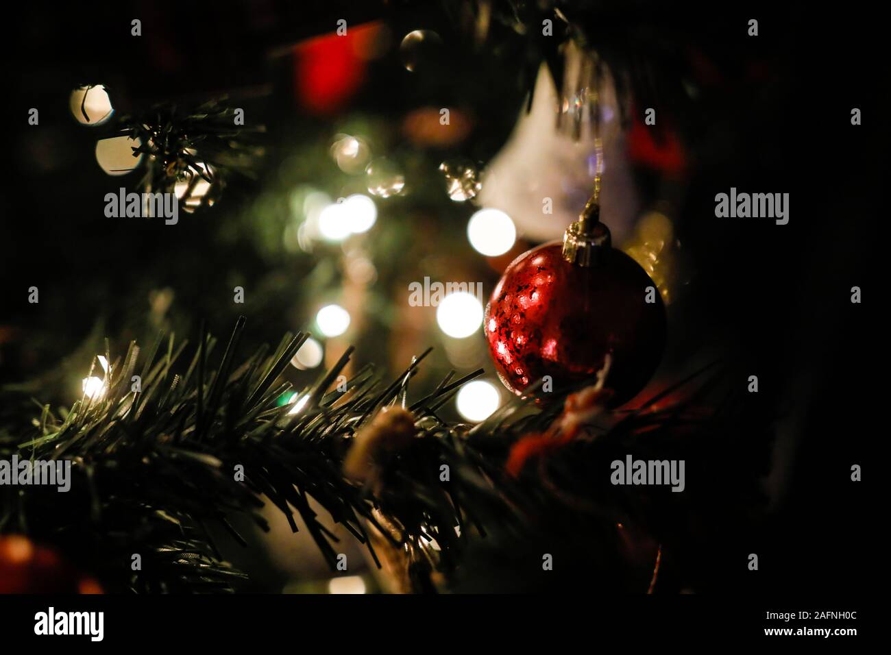 Shallow depth of field (selective focus) image with decorations on an artificial christmas tree Stock Photo