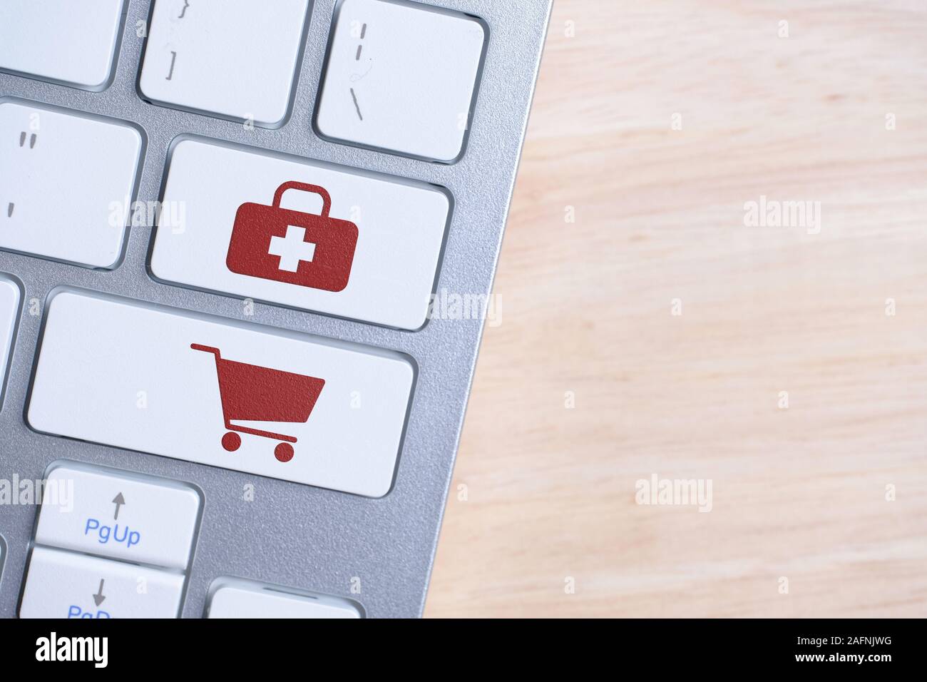 The concept of buying medicines online. Red signs on keyboard buttons. Close up. Stock Photo