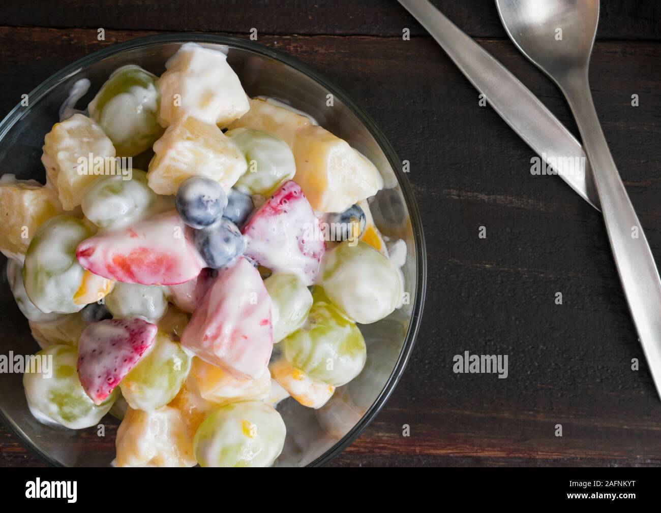 Healthy Ambrosia Fruit Salad with Vanilla Yogurt Dressing Stock Photo
