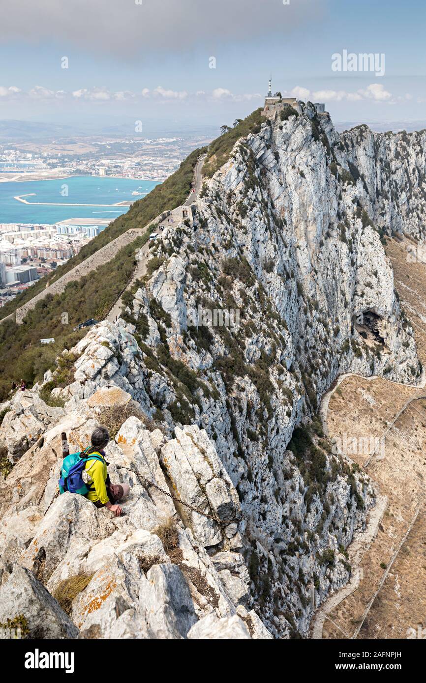 Hiker with rucksack on ridge, Rock of Gibraltar Stock Photo