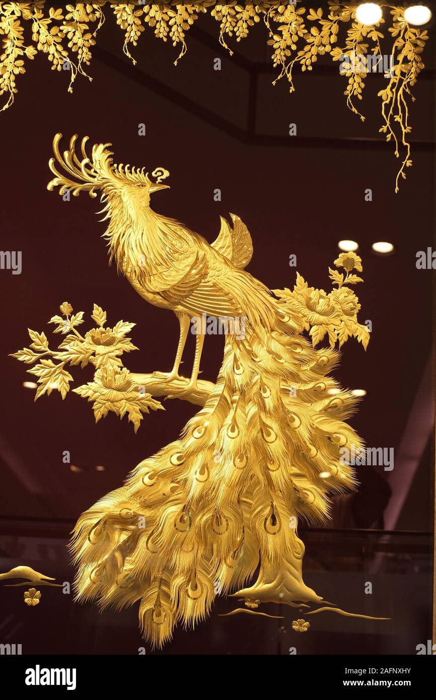 Real gold peacock in a frame Stock Photo Alamy