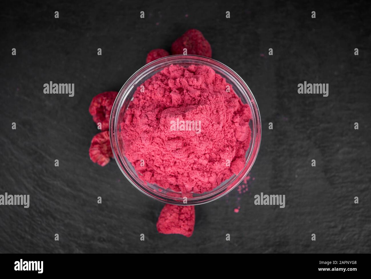 Fresh made Raspberry powder on a vintage background as detailed close ...