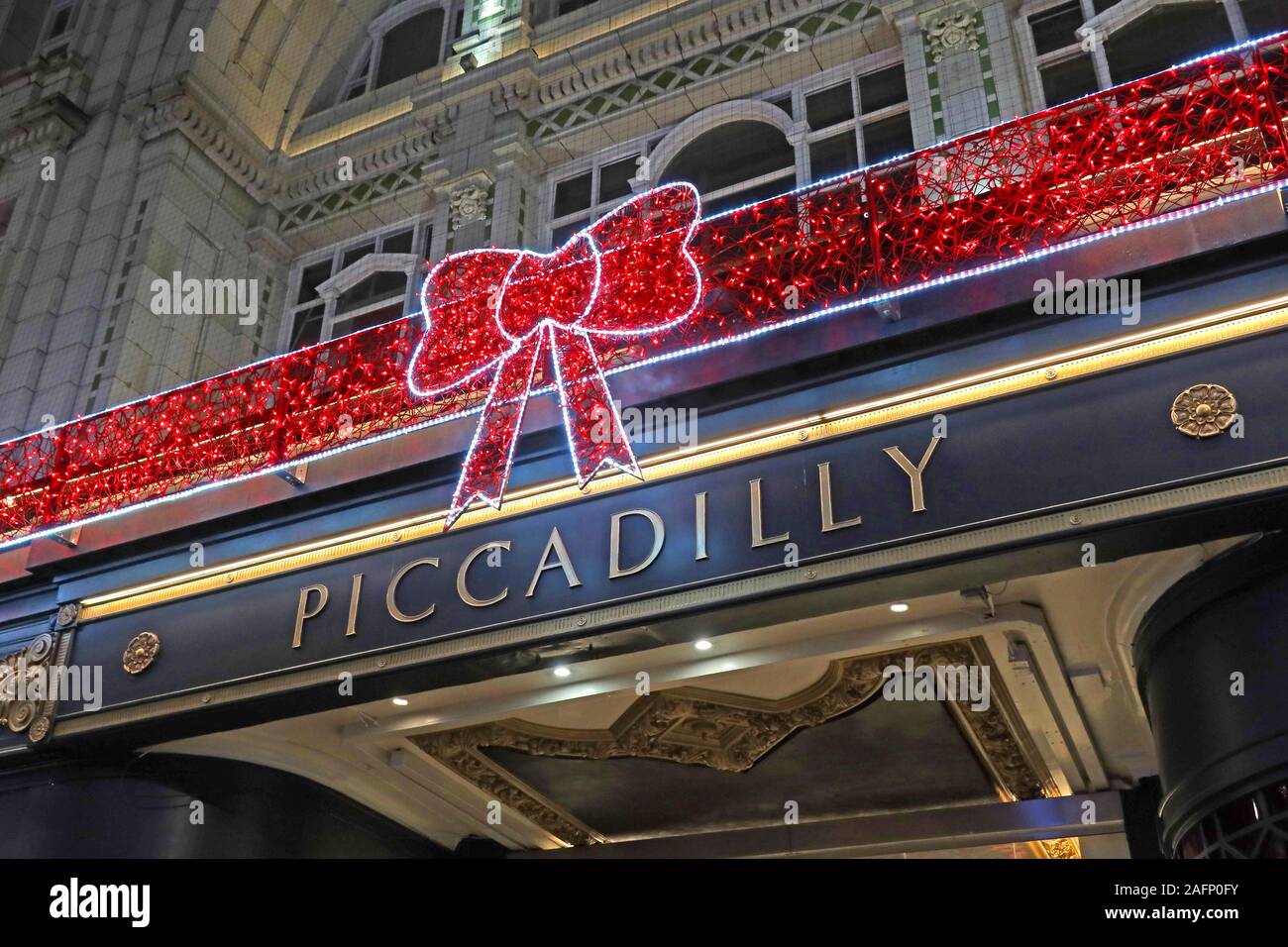 Piccadilly Arcade, New Street, Birmingham, West Midlands, England, UK - retail units at Christmas - decorative bow Stock Photo