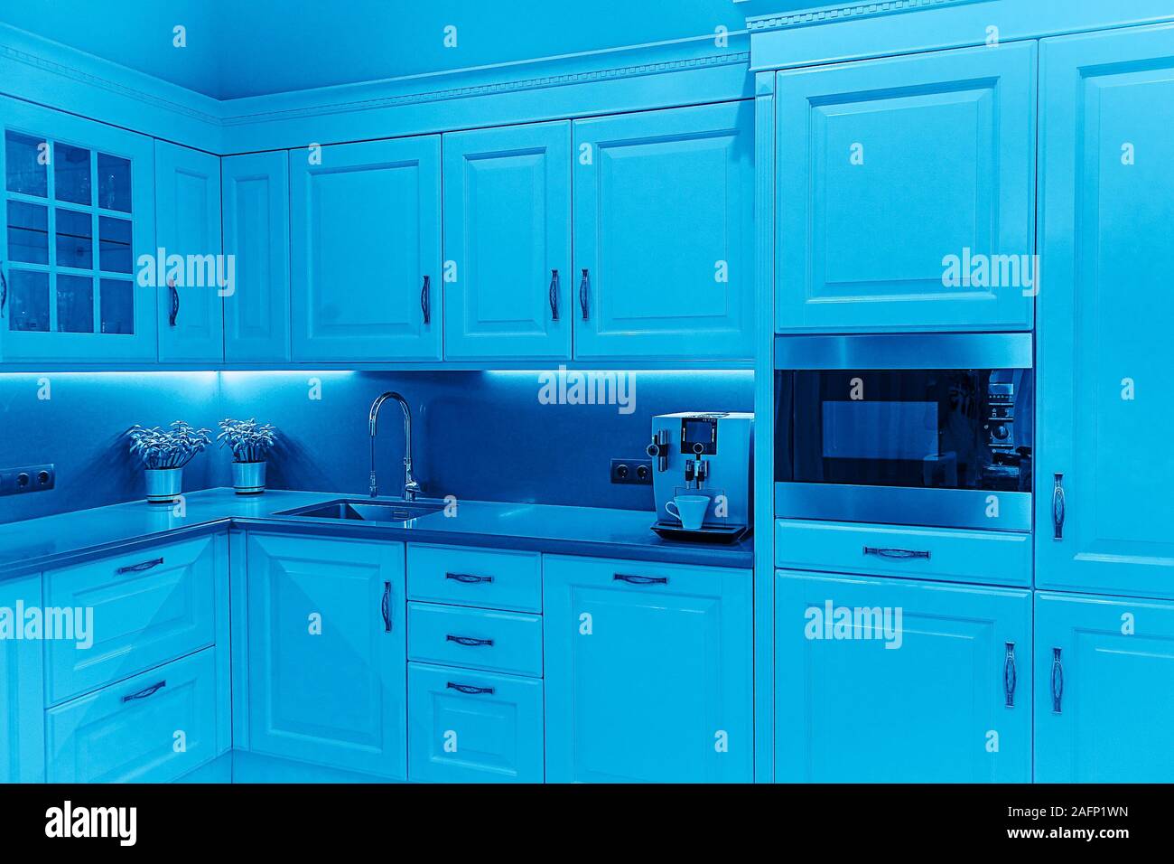 Luxury modern beige and white kitchen interior. Classic Blue color 2020 concept. Stock Photo