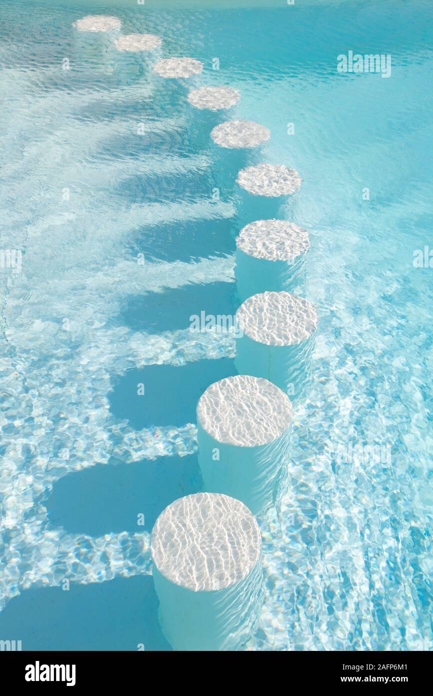 Round bar stools under water. Healthy lifestyle, adventure. Outdoor