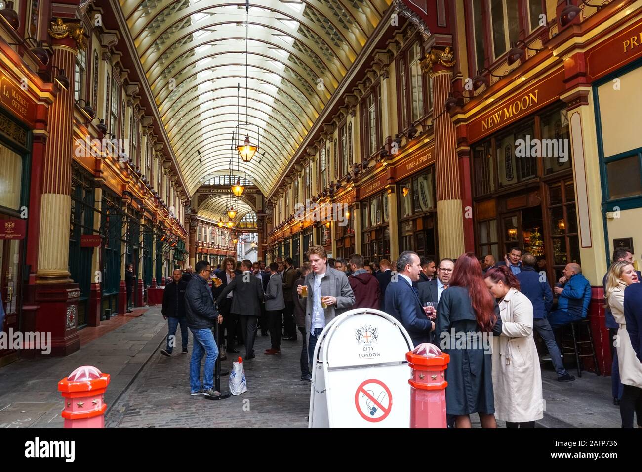 City workers drinking beer outside pub at Leadenhall Market in London, England, United Kingdom, UK Stock Photo