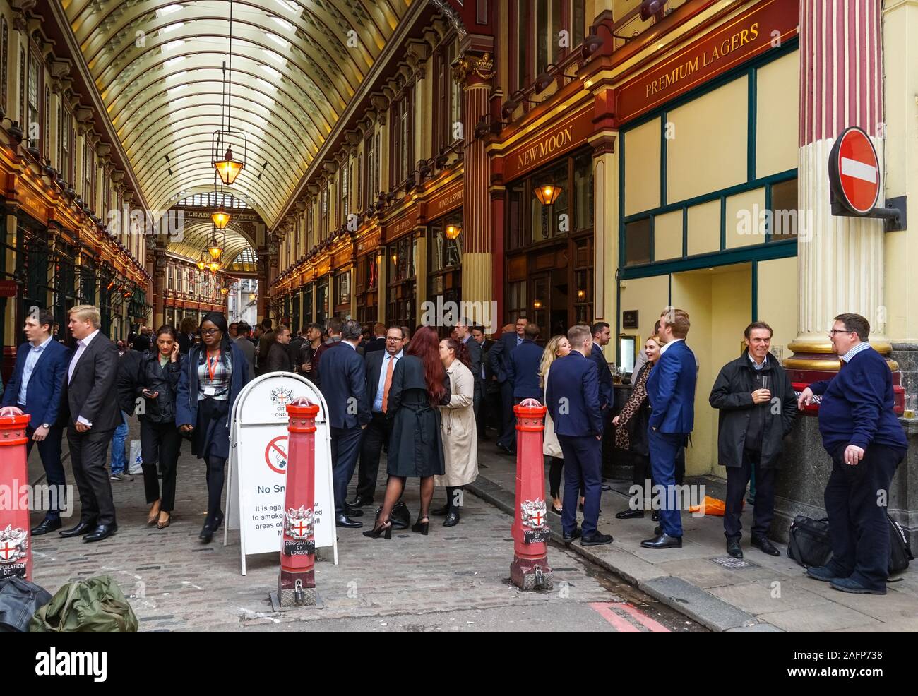 City workers drinking beer outside pub at Leadenhall Market in London, England, United Kingdom, UK Stock Photo