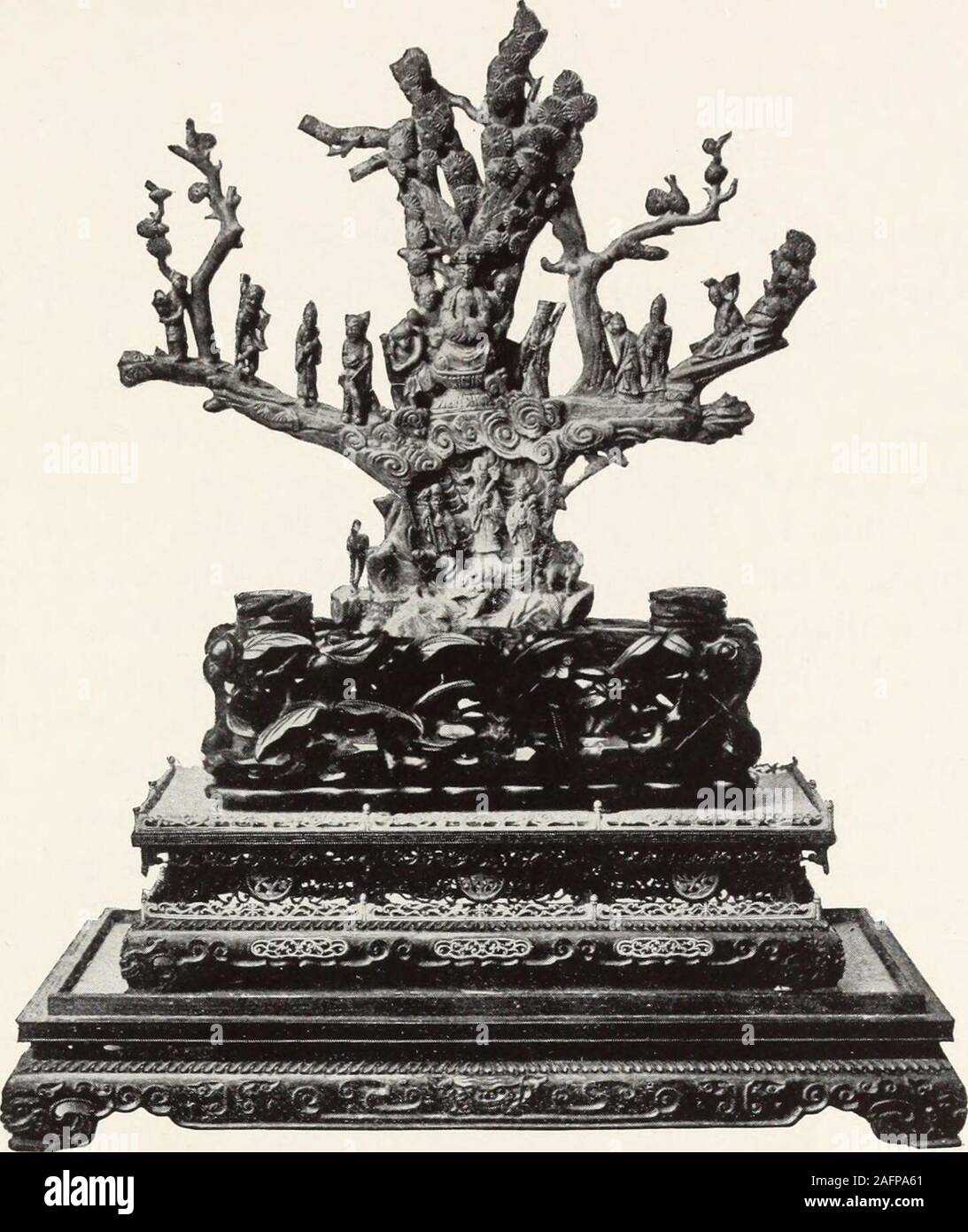 . Rare and beautiful Oriental art treasures of supreme quality. 142—Imperial Wedding Gift {CJiien-lung) Coral statuette of Lan Tsai-ho, of the eight Taoist genii,carrying her basket of flowers. The tall, standing, lithe-some figure is carved from a single piece of richly mottledpink coral, with her abundant robes hanging in naturalfolds, and a high headdress, and she is shown smiling. Inone hand she holds a branch of the sacred fungus. Withthe other she supports over her shoulder the basket offlowers depending from a bamboo branch, the flower-basketand branch being separately carved and attach Stock Photo