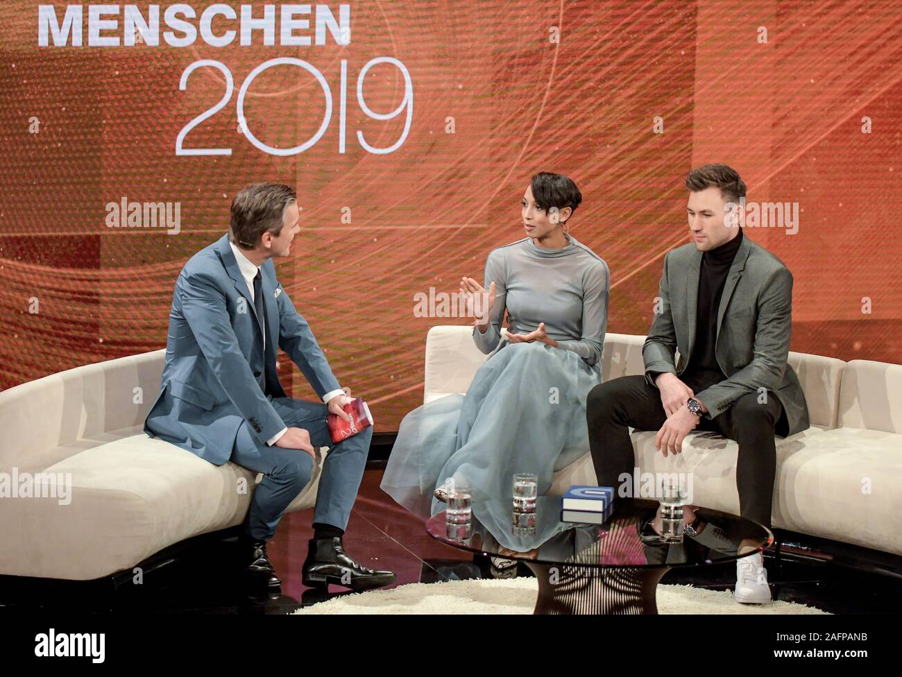 Hamburg, Germany. 16th Dec, 2019. The world champion in long jump, Malaika  Mihambo, and the world champion in decathlon, Niklas Kaul (r), are  interviewed by presenter Markus Lanz during the ZDF recording