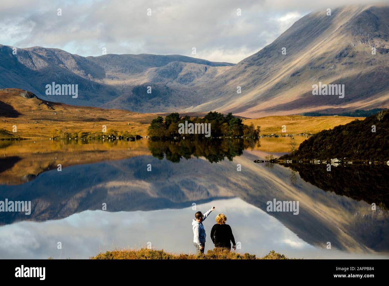 View over Lochan na h-Achlaise in Ranoch Moor, which looks Autumnal this morning as Scotland wakes up to bright sunshine throughout the day.  Credit: Euan Cherry Stock Photo