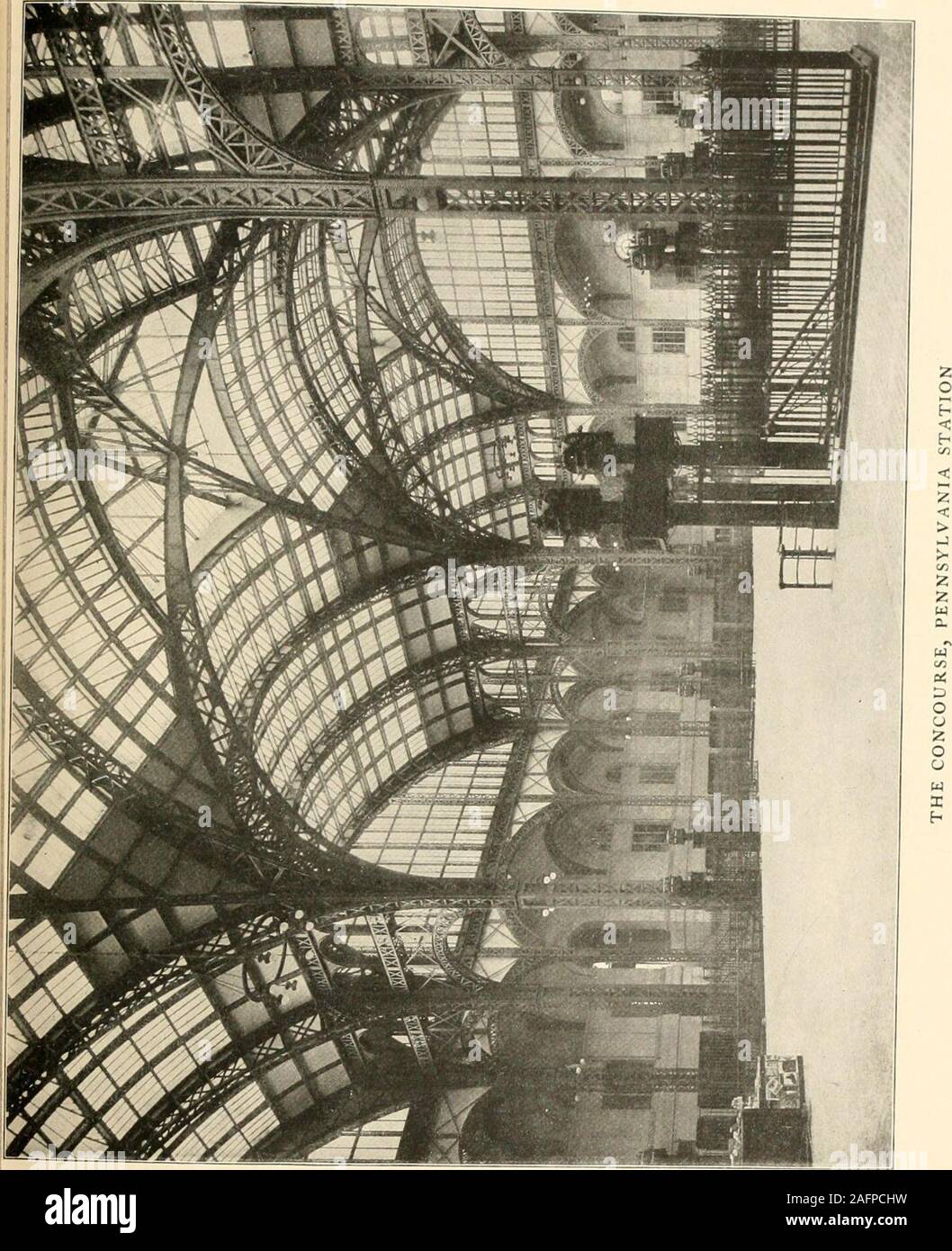 . Charles Follen McKim; a study of his life and work. noise, no dirt, no confusion. Youare in an even larger room than the main waiting-room, a room as light as out of doors, for it is really acourt covered with glass. The steel structure supporting this glass roof is again devoid of ornamentation orembellishment of any sort, but wonderfully impress^ive from the supreme beauty of line and function likethe lean, lithe frame of a young athlete stripped ofevery ounce of superfluous flesh. From this concourseone descends by very easy steps to a platform on thelevel of the floor of the cars, which Stock Photo