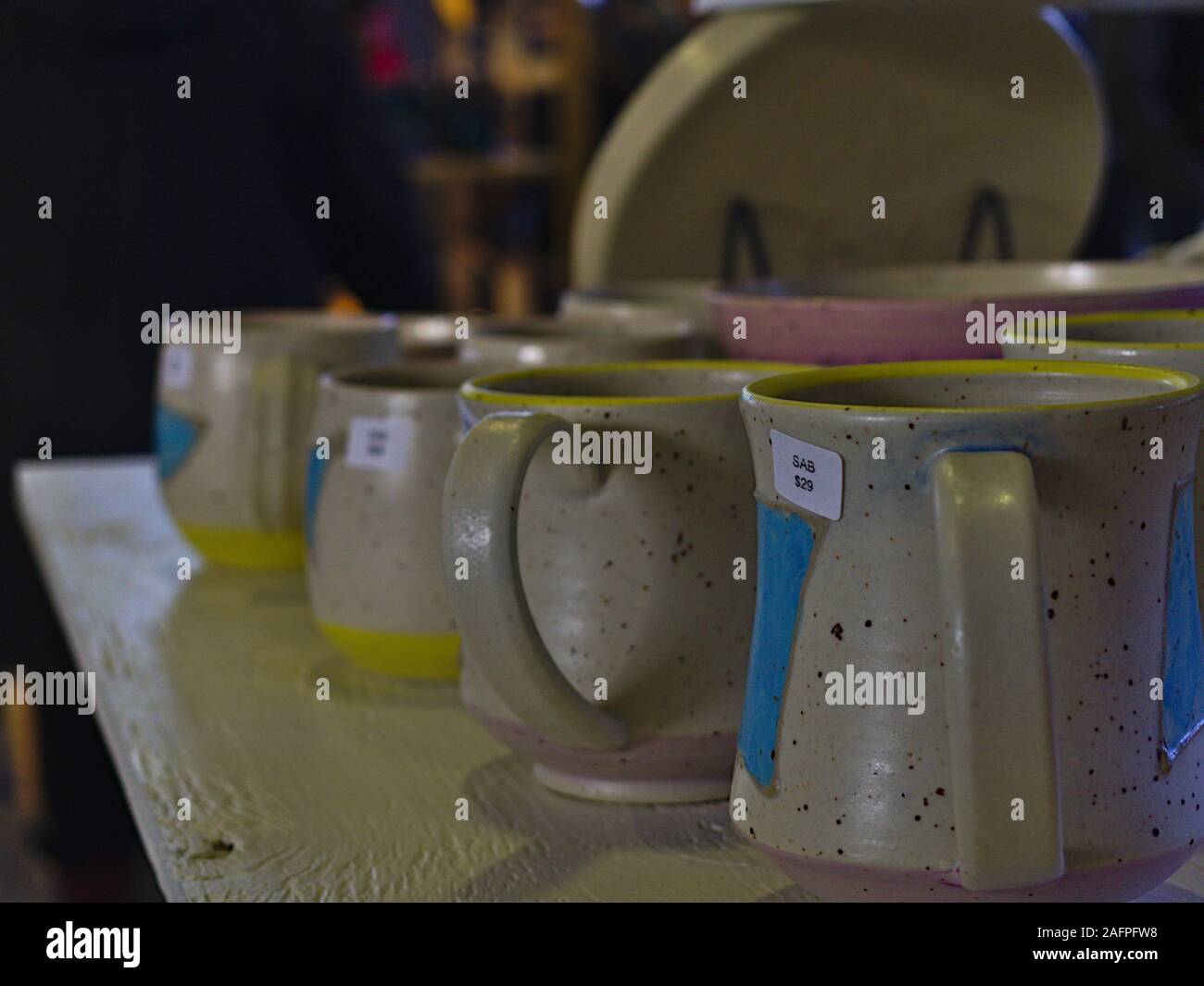 Row of stoneware mugs at the Ottawa Potters Guild annual Holiday Sale