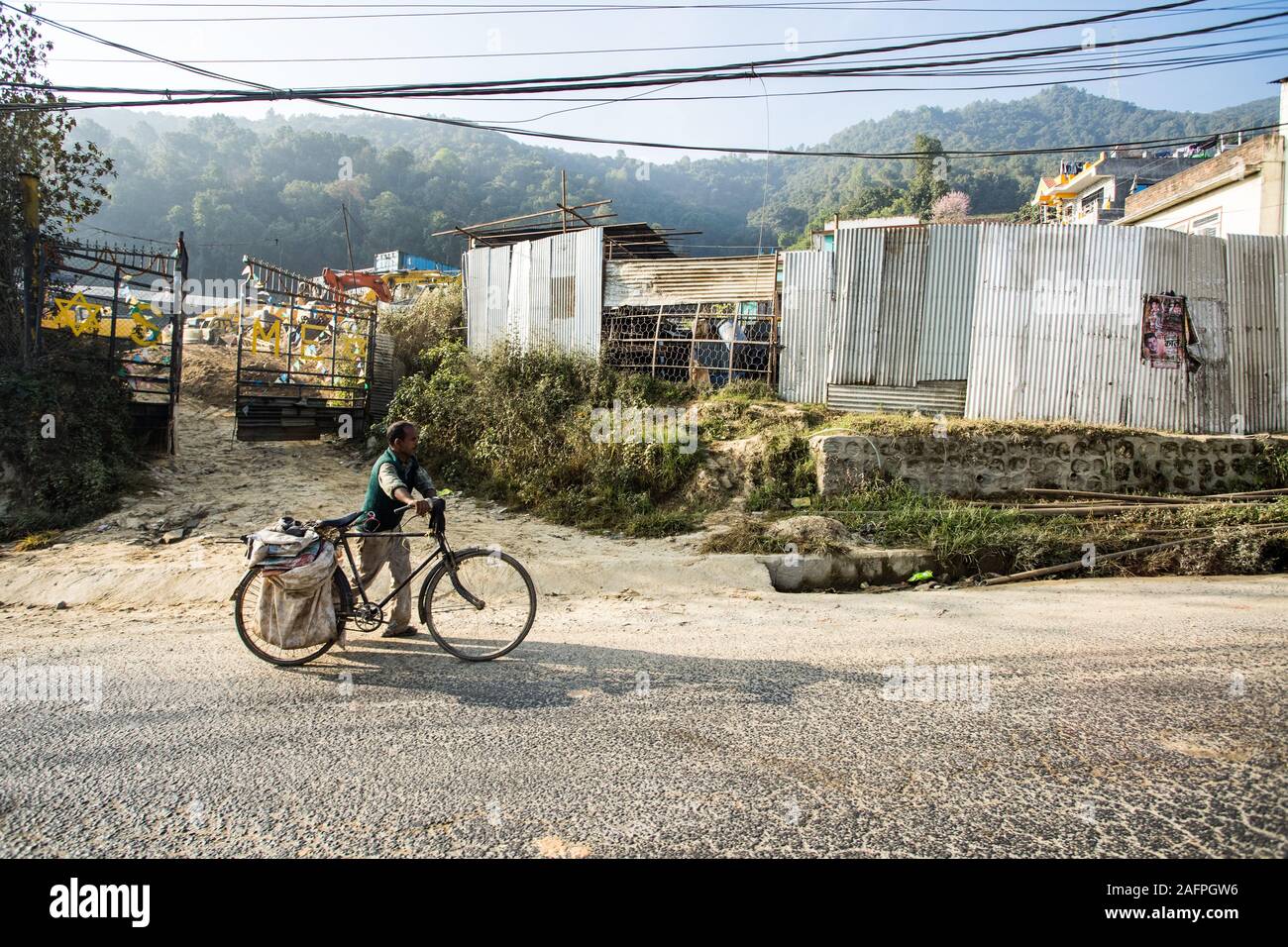 Man with bike on Nepal Highway Stock Photo