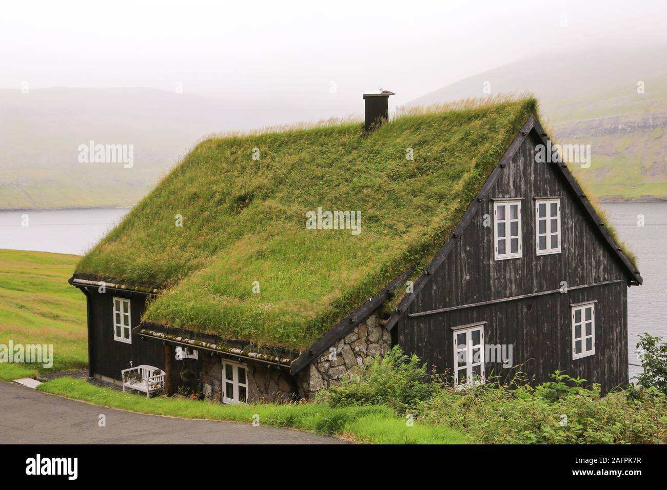 A sod covered roof on a house in Bøur, on Vágar Island,  Faroe Islands Stock Photo