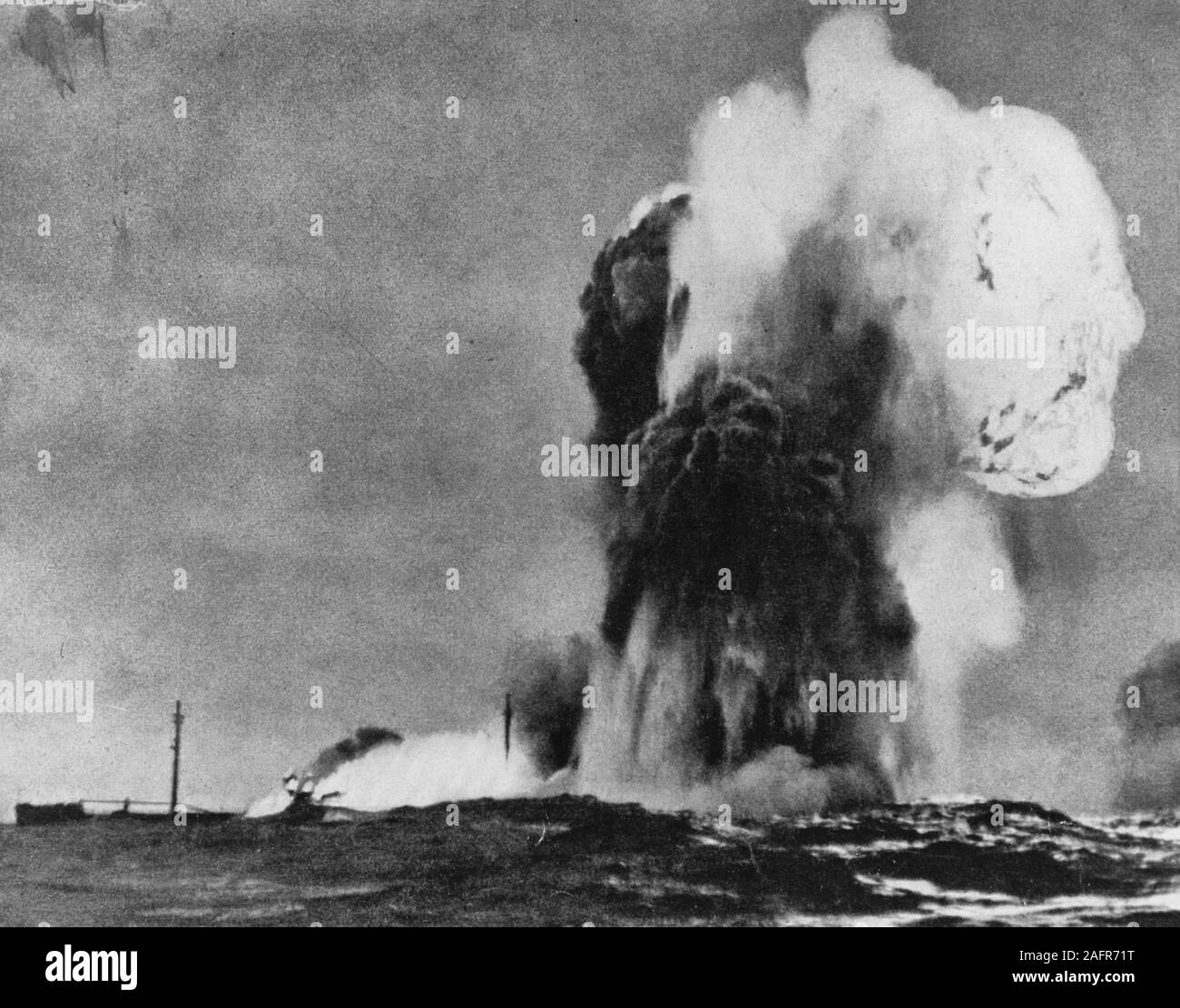 A British Tanker Blows Up - After being torpedoed by a German submarine. Copied from a German book on their navy, published during World War II. Stock Photo