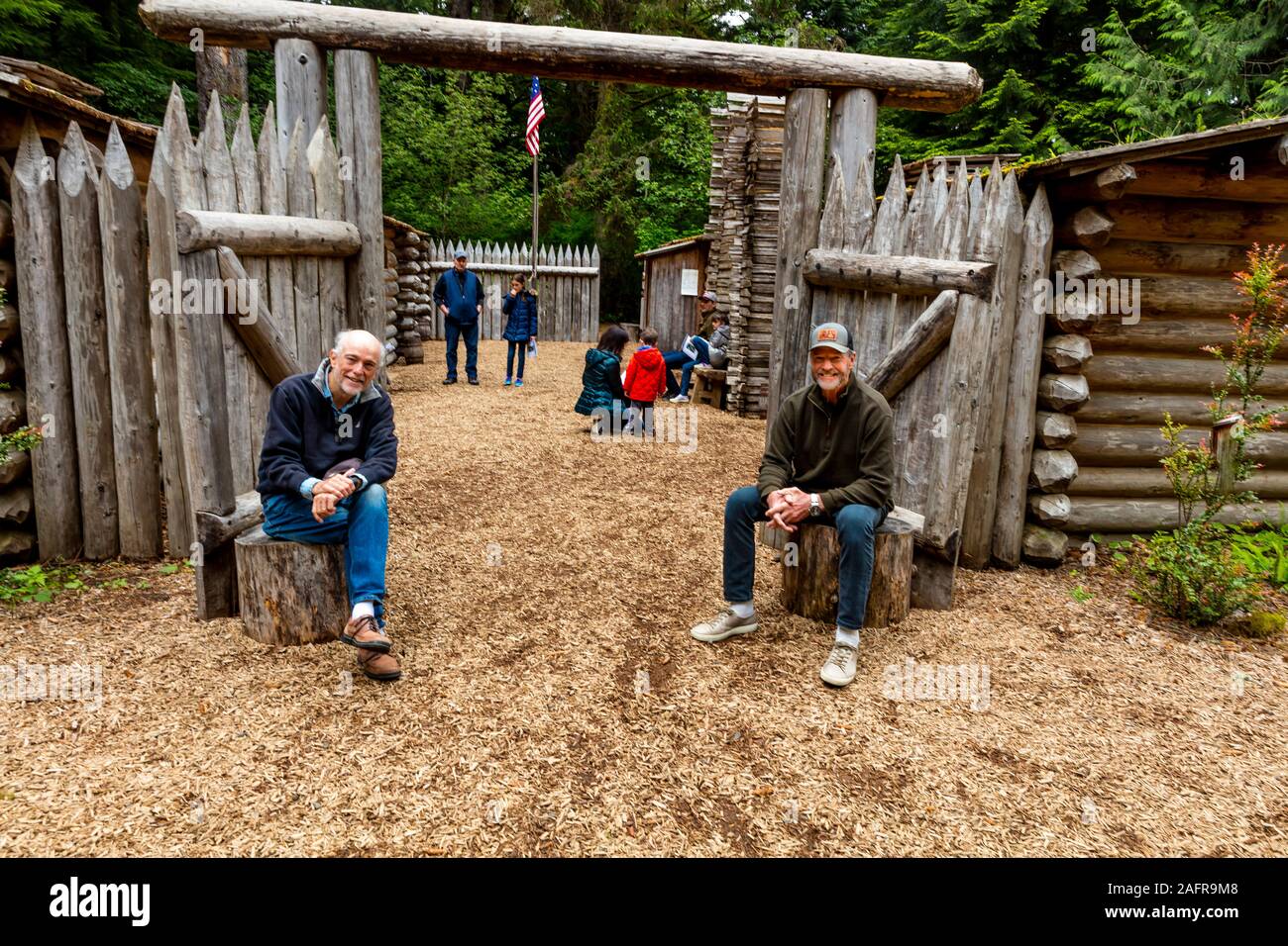 MAY 28 2019, ASTORIA, OREGON, USA - Joe Sohm and Bill Terry pose in front of Historic Fort Clatsop, Oregon, site of the Lewis and Clark Expedition - 1804-1806 outside of Astoria, Oregon Stock Photo