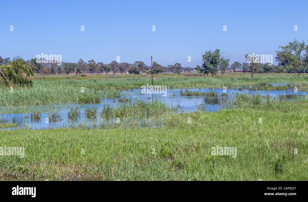 Low lying land flooded after heavy seasonal rainfall image in horizontal format with copy space Stock Photo