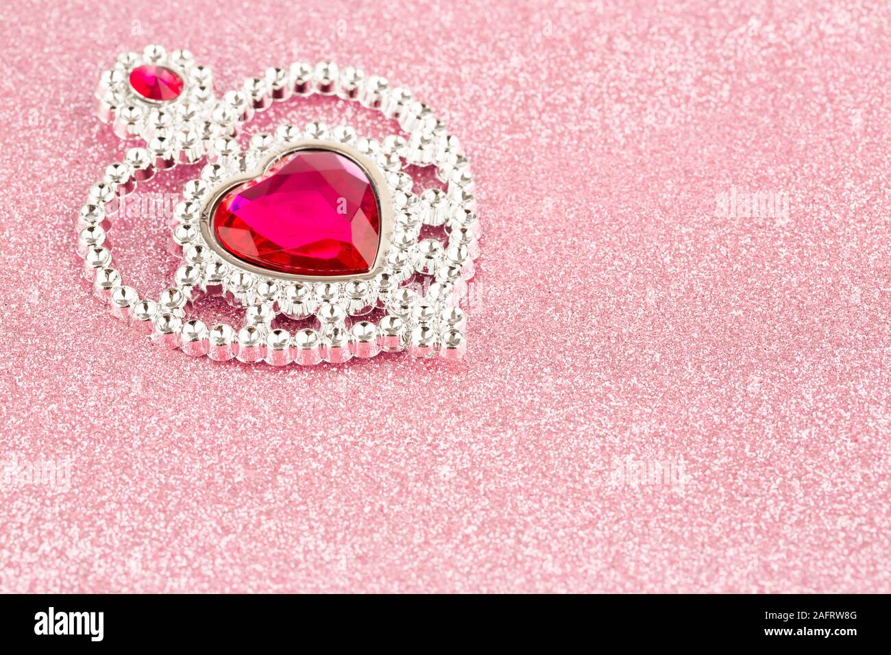 Jewelry heart with stones on pink sparkling background Stock Photo Alamy