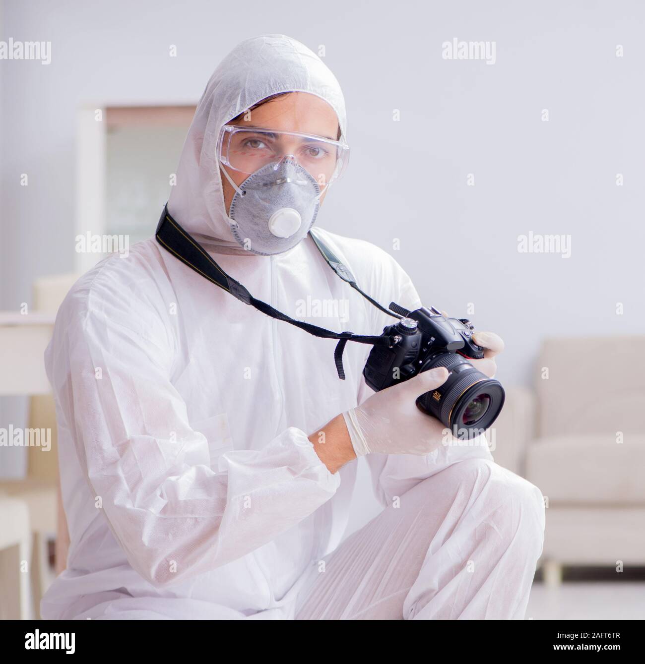 The forensic expert at crime scene doing investigation Stock Photo