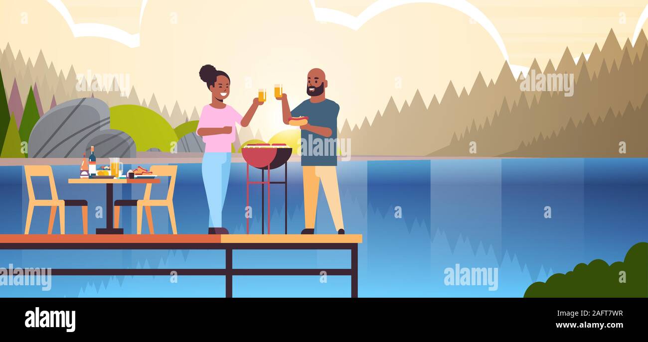 happy couple preparing hot dogs on grill and drinking juice african american man woman in love standing on wooden pier having picnic concept river bank landscape background full length horizontal vector illustration Stock Vector