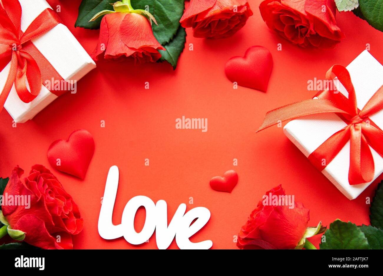 Valentines day romantic background - red roses, gift and hearts on a ...