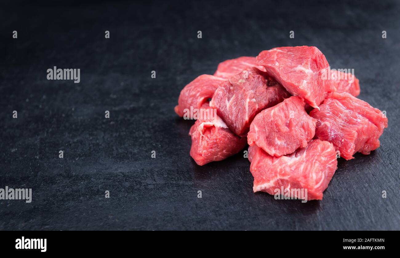 Slate Slab with chopped Beef (close-up shot; selective focus) Stock Photo