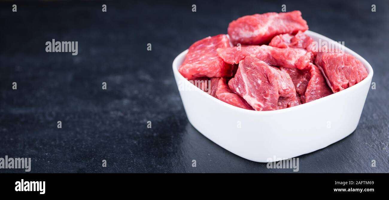 Slate Slab with chopped Beef (close-up shot; selective focus) Stock Photo